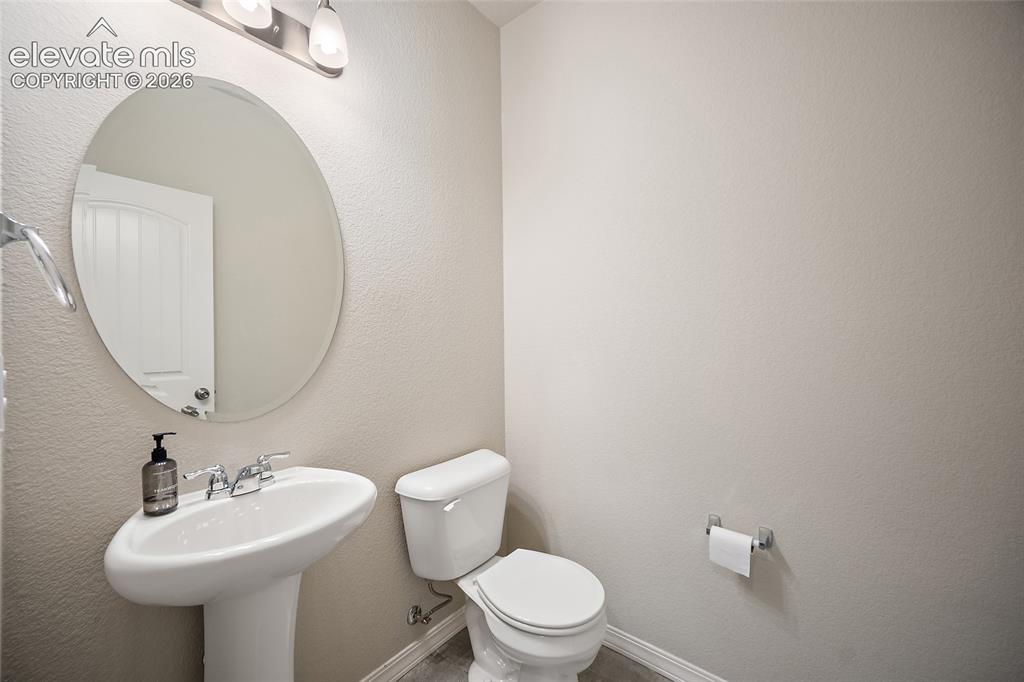 Image 18 of 46: Main Floor Half Bath