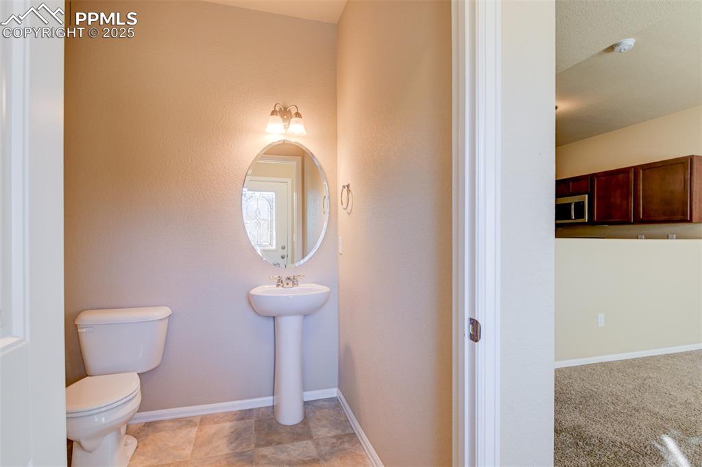 Image 18 of 33: 1/2 bathroom on the main level