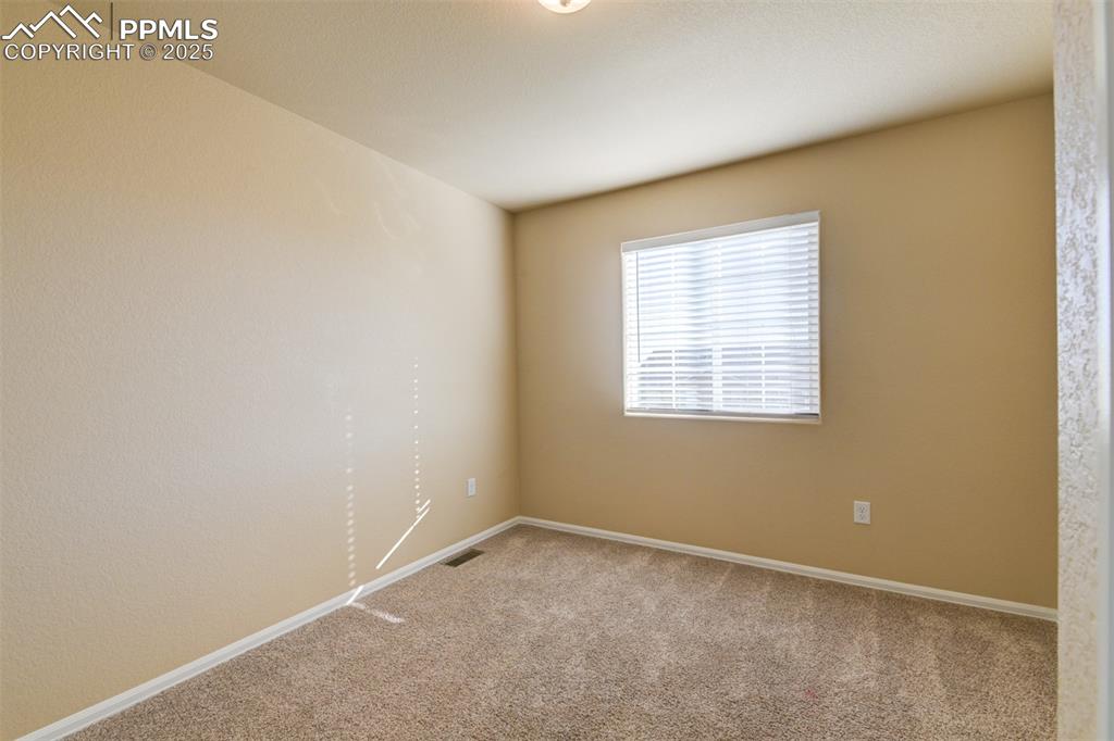 Image 29 of 33: 3rd bedroom