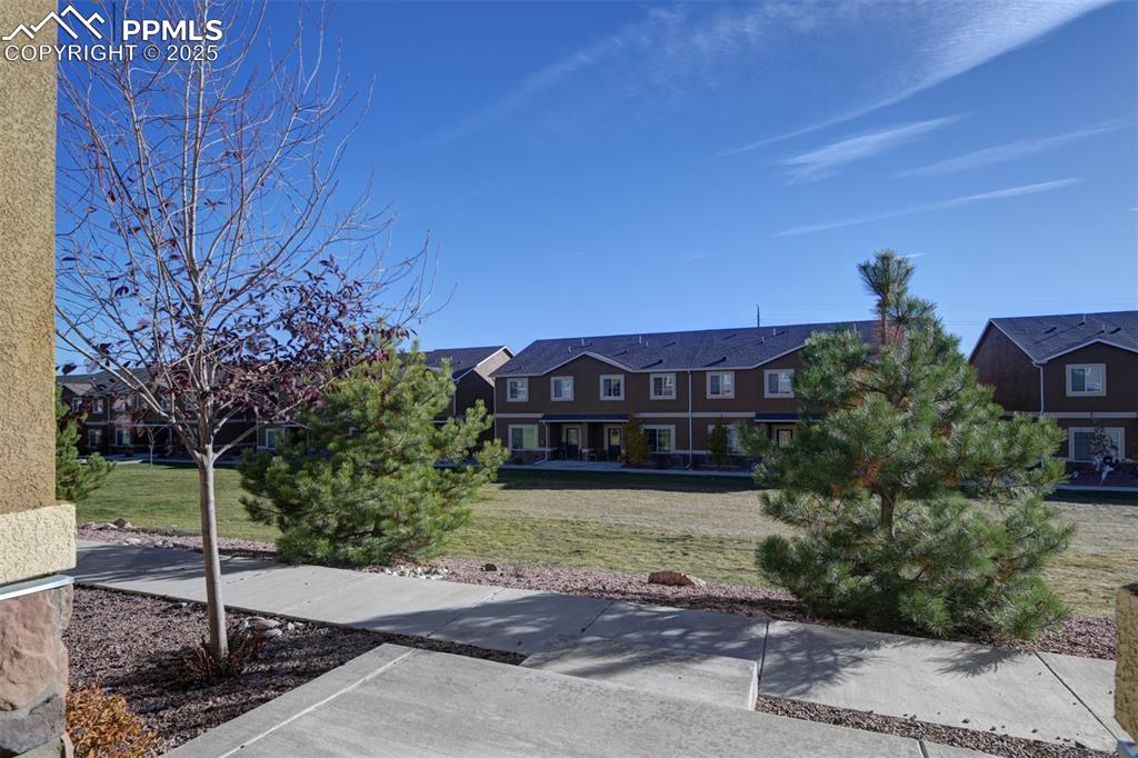 Image 6 of 33: View of front of house with a front lawn
