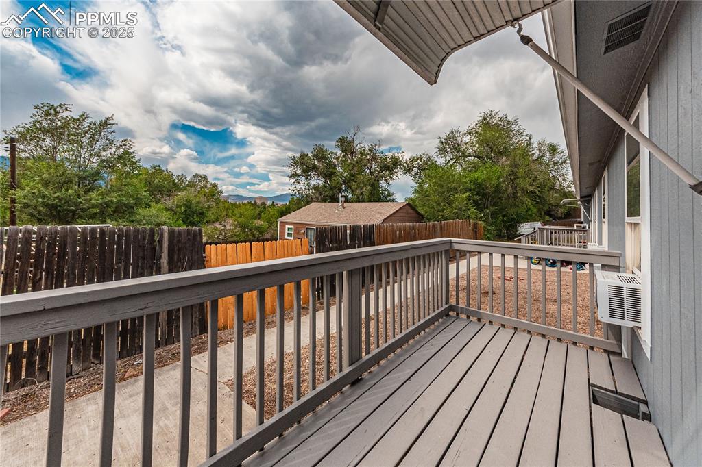 Image 34 of 42: Deck with a fenced backyard