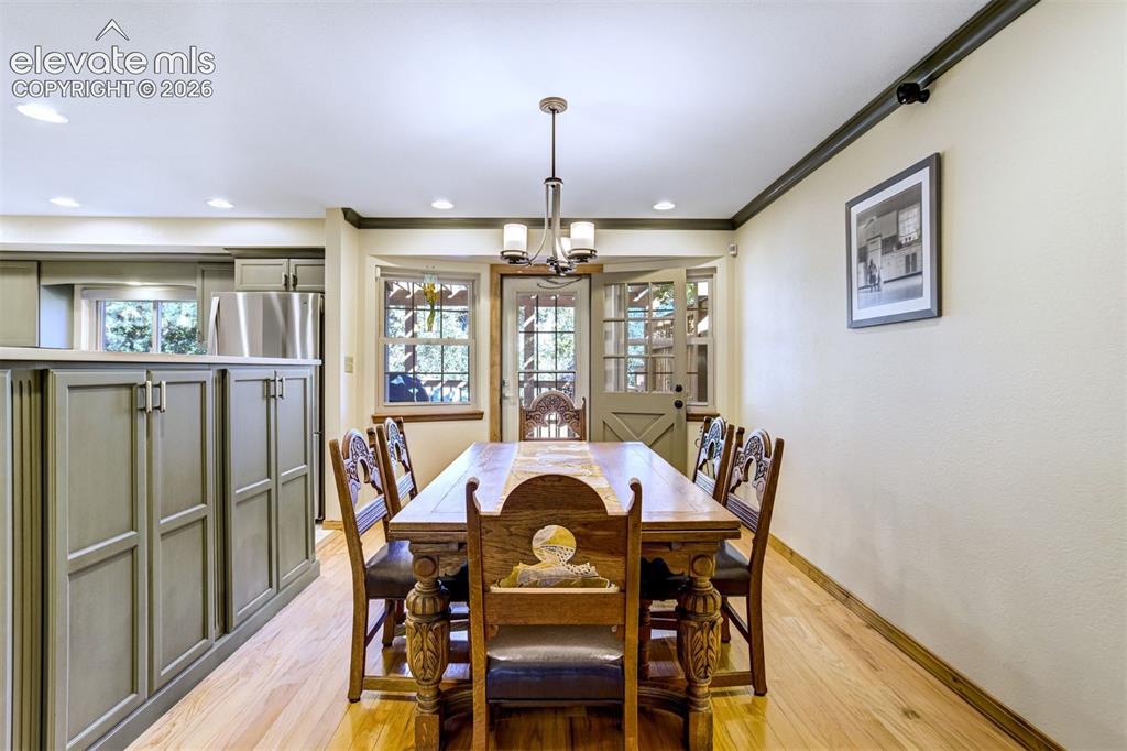 Image 12 of 50: Formal dining with walk-out to expansive deck
