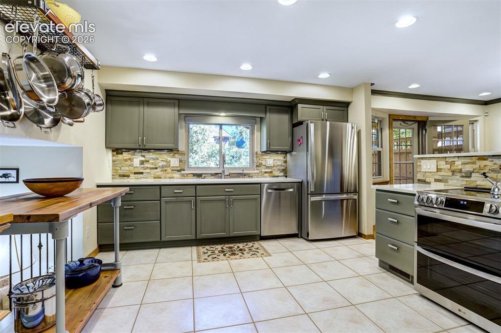 Image 16 of 50: Quartz countertops and soft-close cabinetry