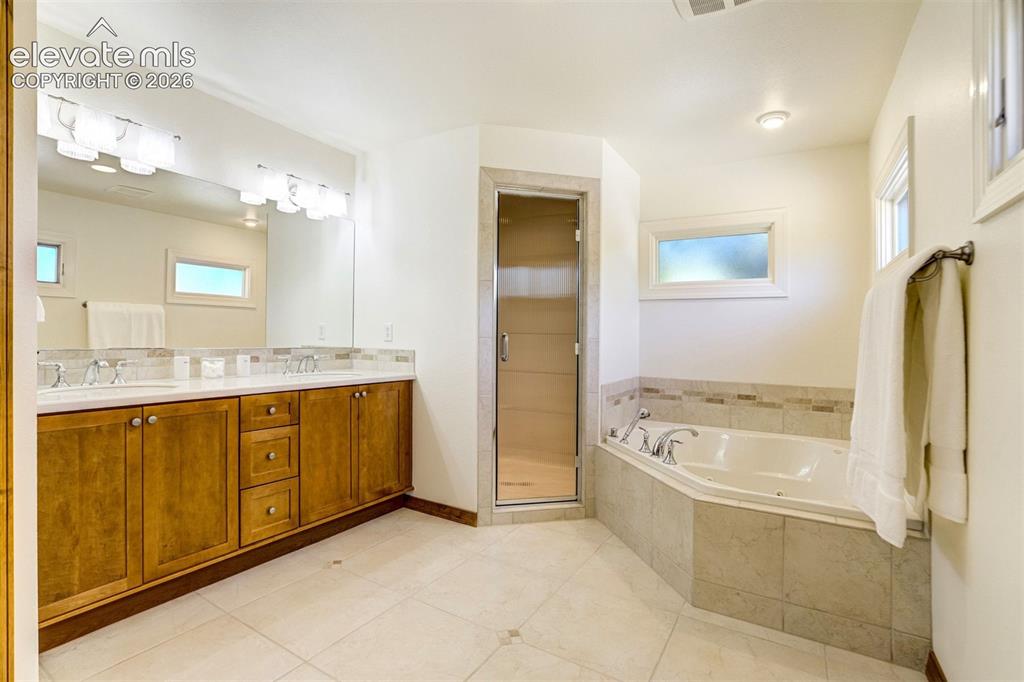 Image 20 of 50: Steam shower in primary bath