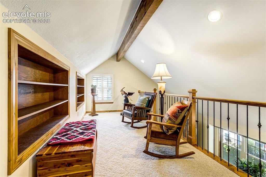 Image 30 of 50: Upper level loft over looking formal living room.