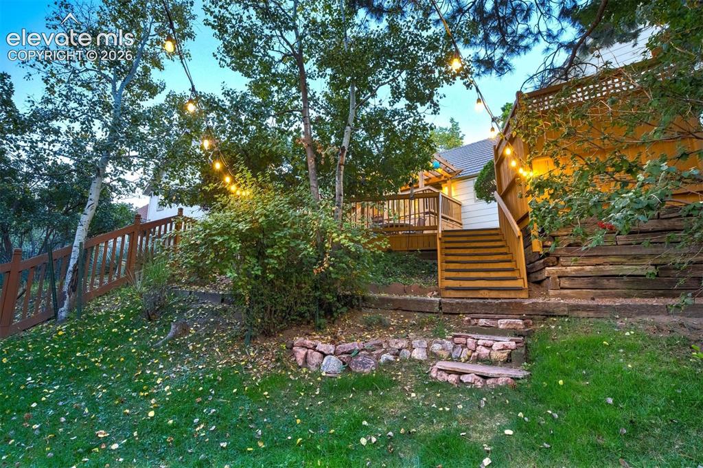 Image 46 of 50: A private garden retreat awaits in the beautifully landscaped backyard, sur
