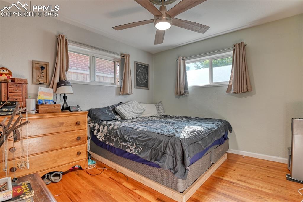 Image 20 of 45: Bedroom featuring light wood-style flooring and ceiling fan