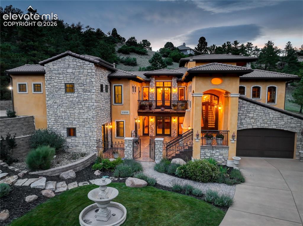 Caption: Front of residence and lower level entrance.