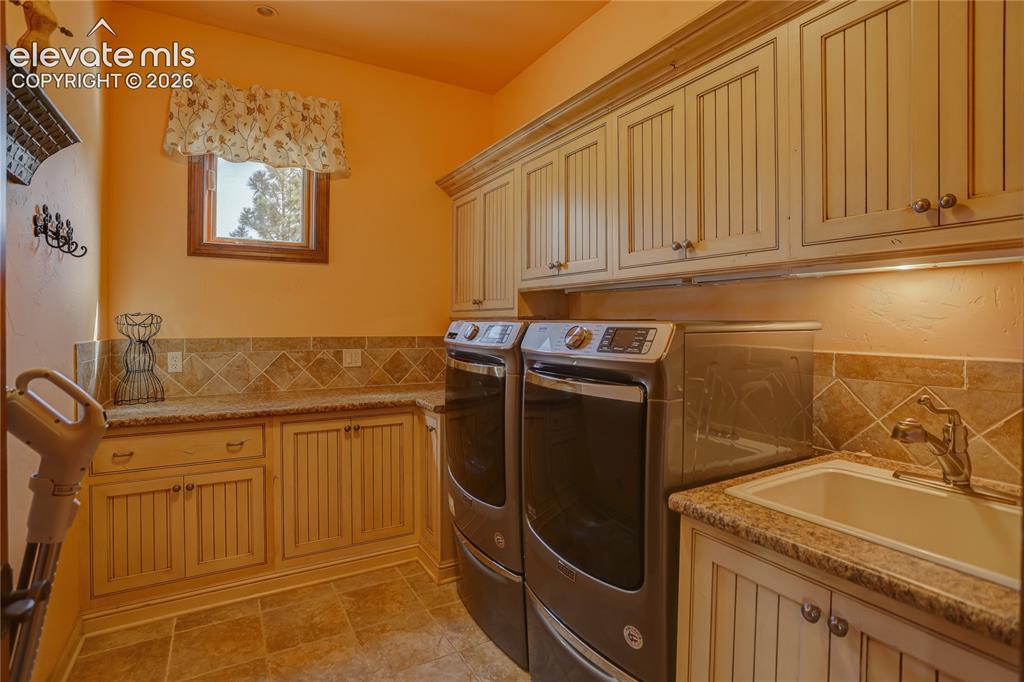 Image 21 of 50: Main level laundry room.