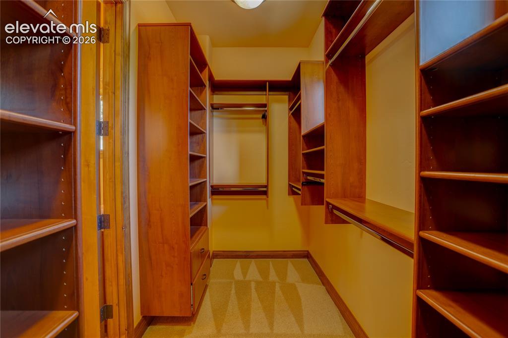 Image 26 of 50: Primary closet.
