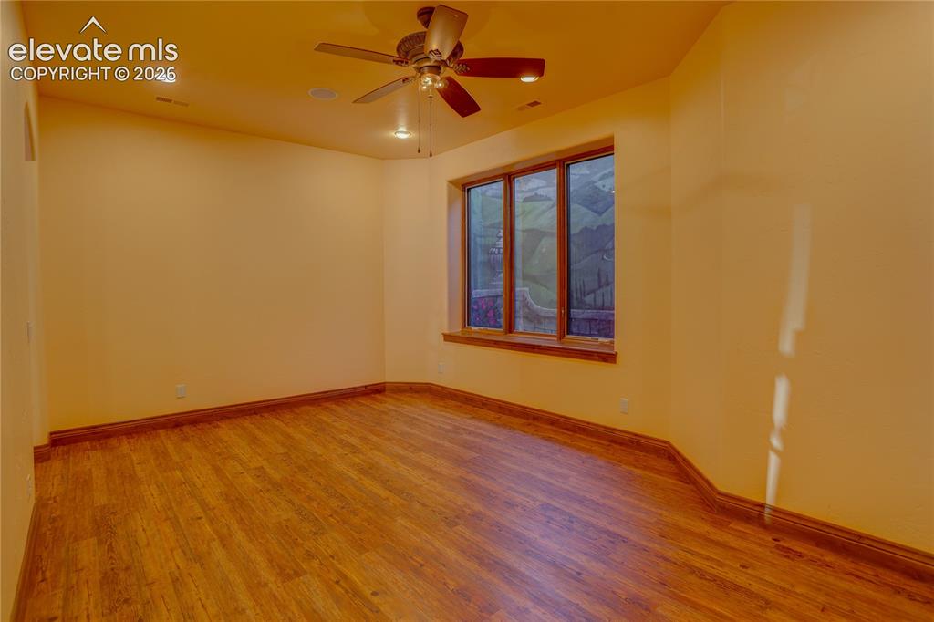 Image 36 of 50: Game room tucked behind wet bar.