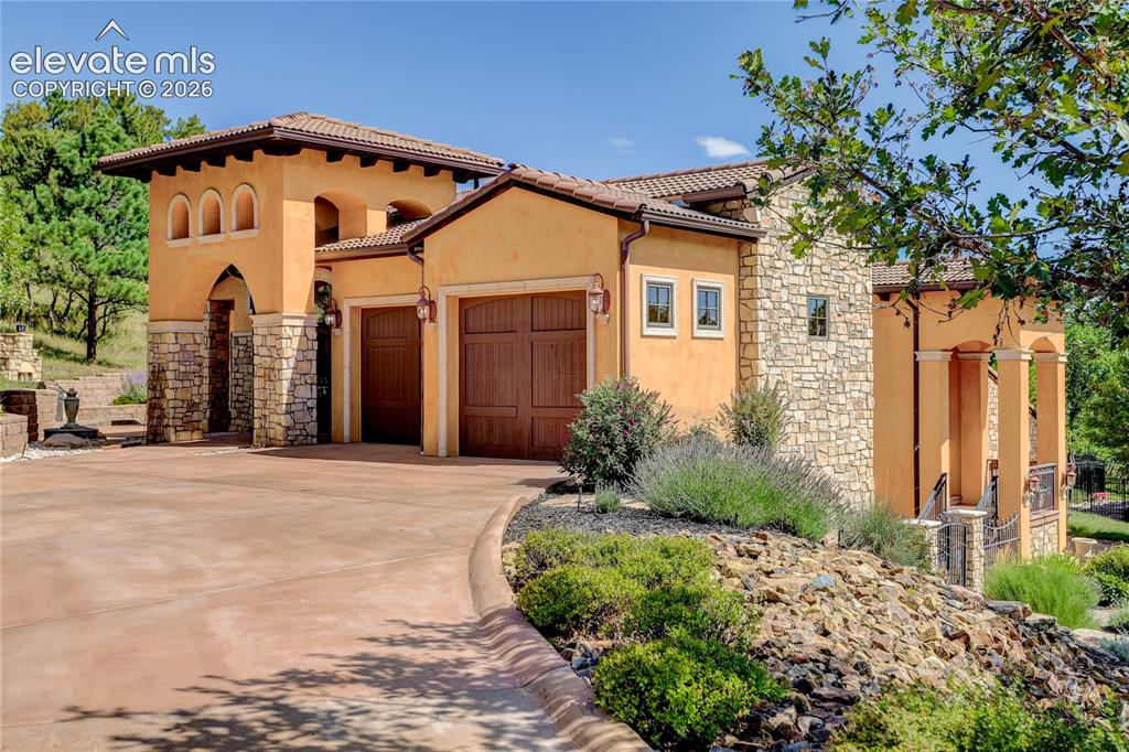 Image 5 of 50: Front of home and main level entrance.