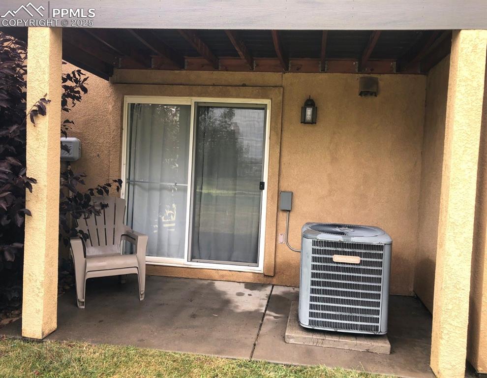 Image 26 of 26: Covered spot faces open grassy area