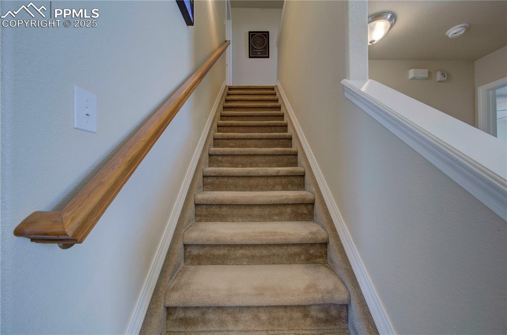 Image 24 of 49: Stairs featuring carpet