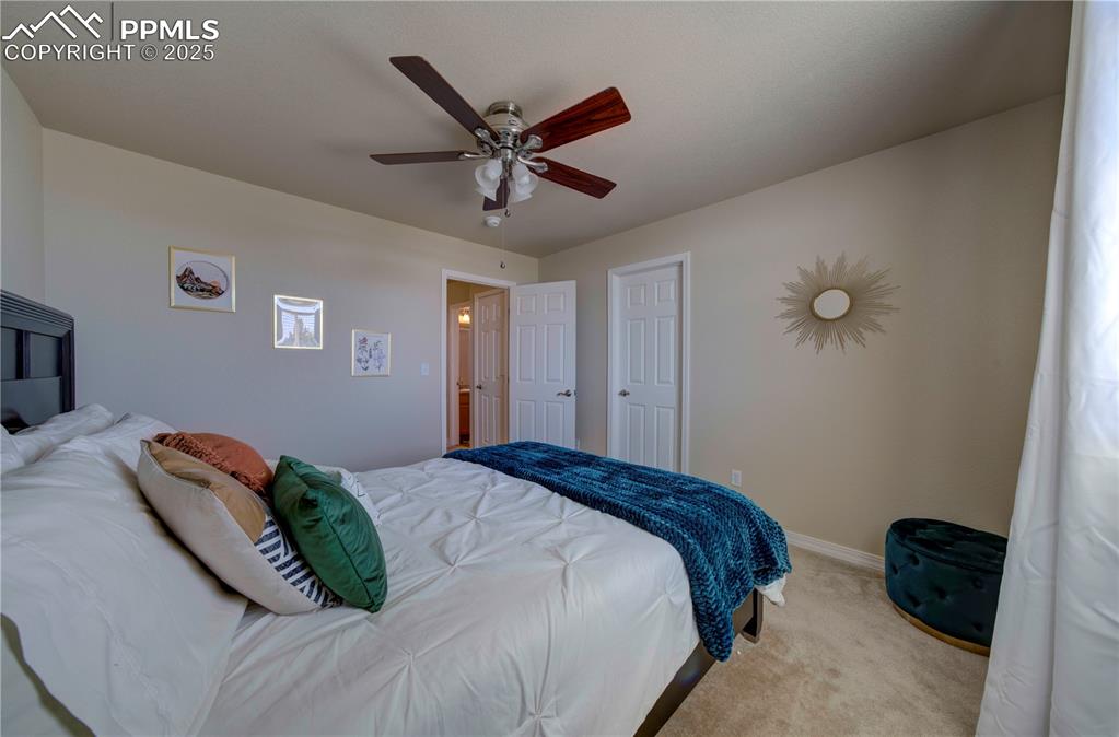 Image 31 of 49: Bedroom with carpet flooring and ceiling fan