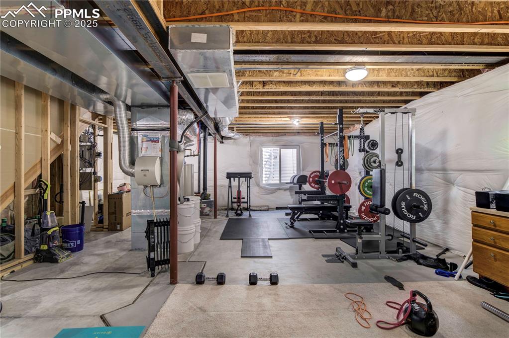 Image 42 of 49: Workout area featuring heating unit