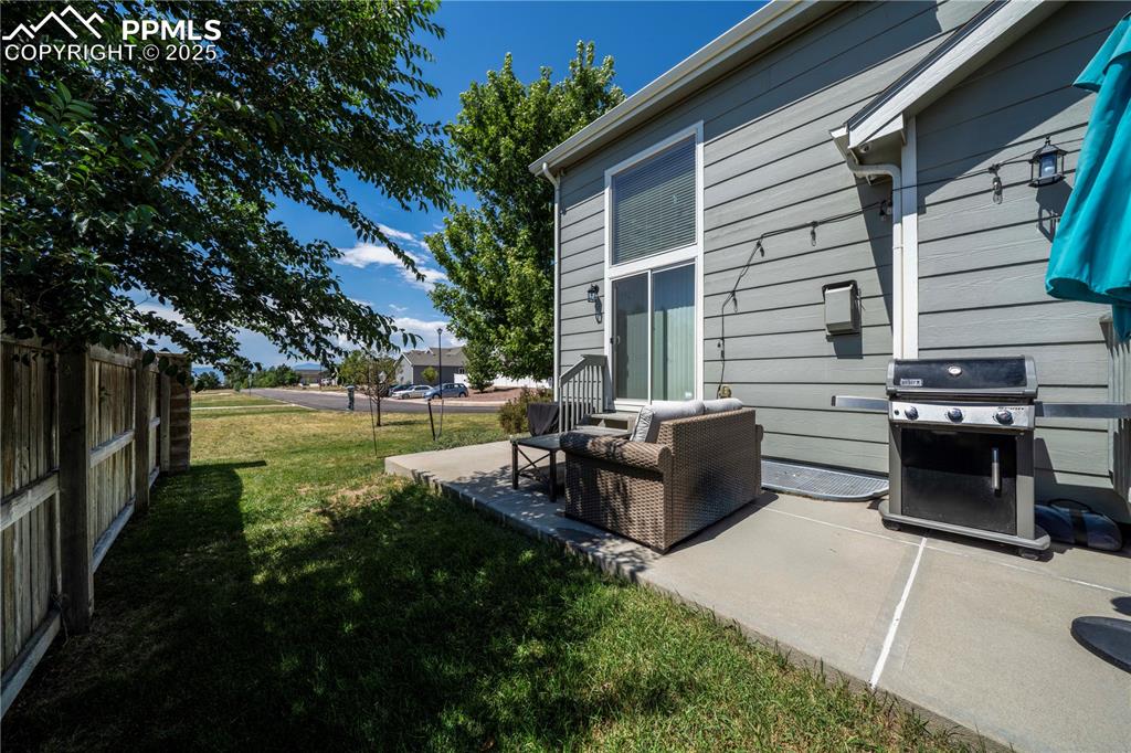Image 43 of 49: View of yard featuring a patio area