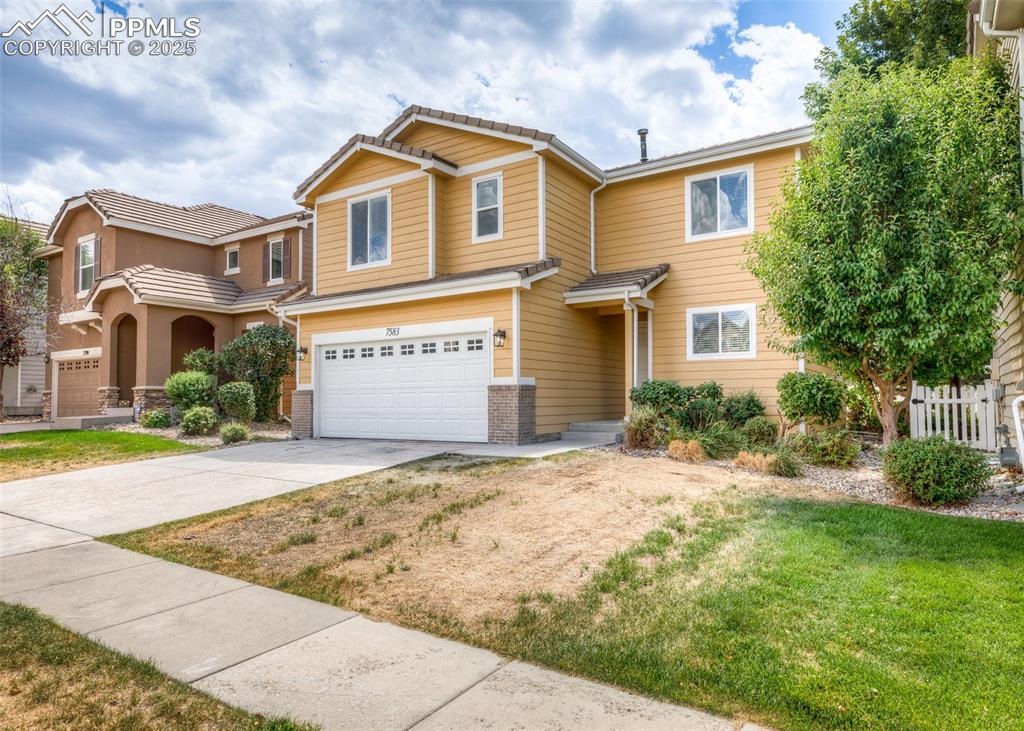 Image 1 of 45: View of front of property with an attached garage and concrete driveway
