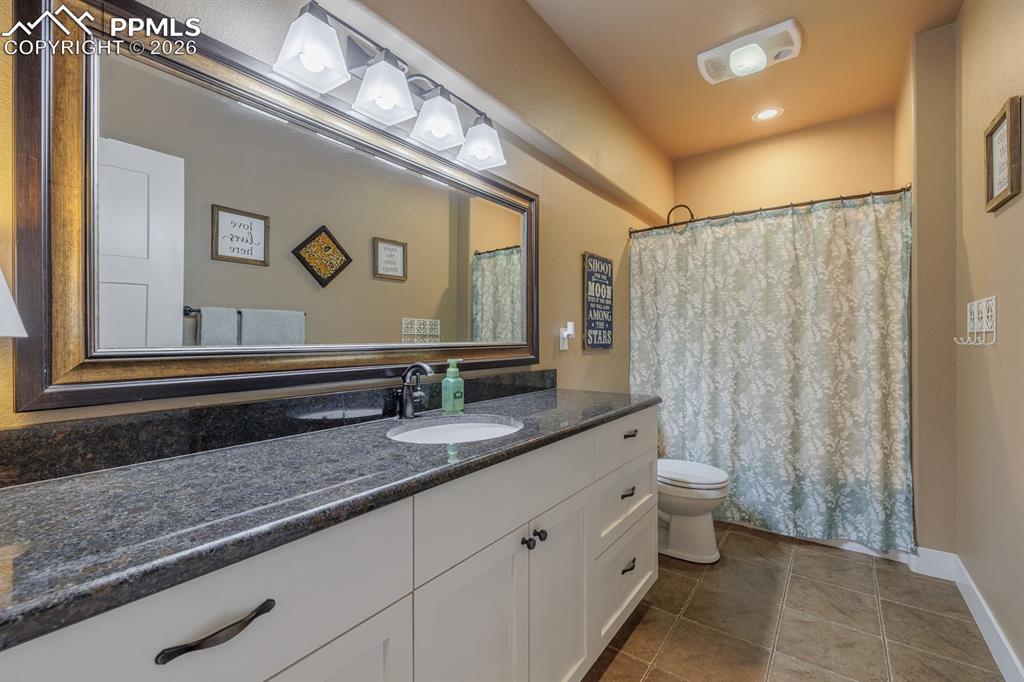 Image 35 of 49: bathroom serving the two lower level bedrooms