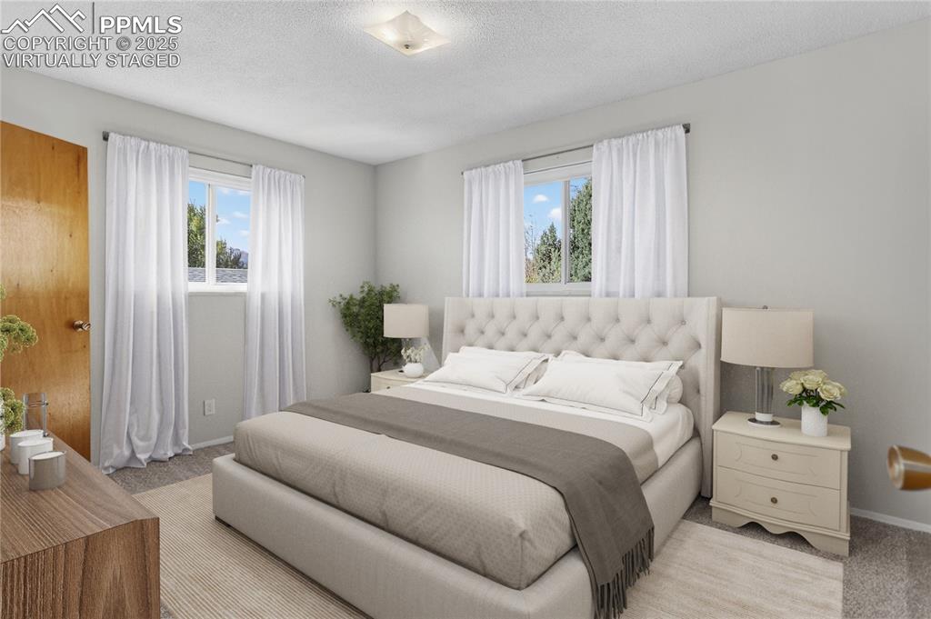 Image 15 of 42: Primary Bedroom - Virtually Staged - Fits a King bed.