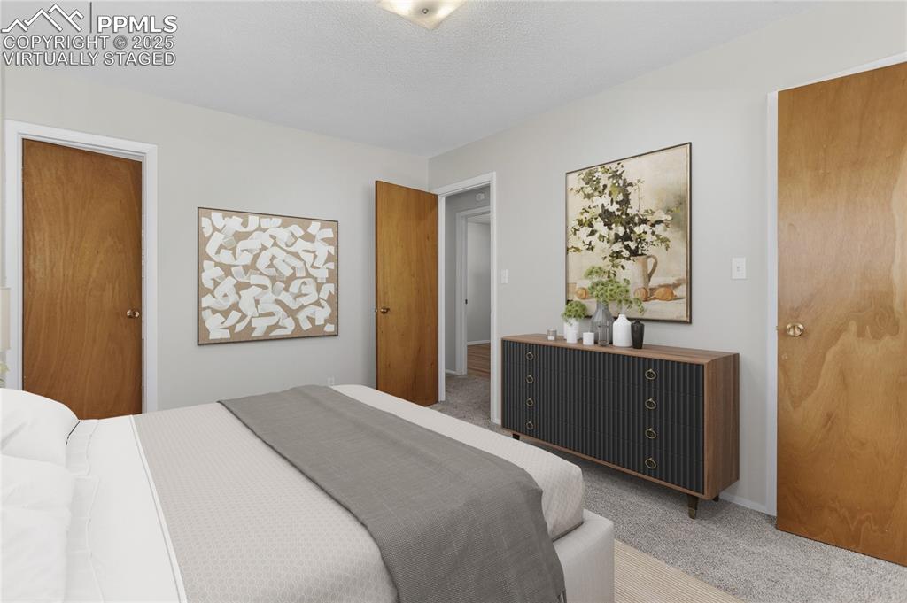 Image 19 of 42: Primary Bedroom - Virtually Staged - Fits a King bed.