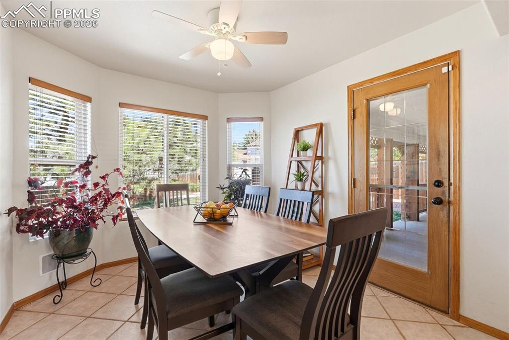 Image 17 of 50: Patio Access, Tile Floors, Ceiling Fan, Bay Window
