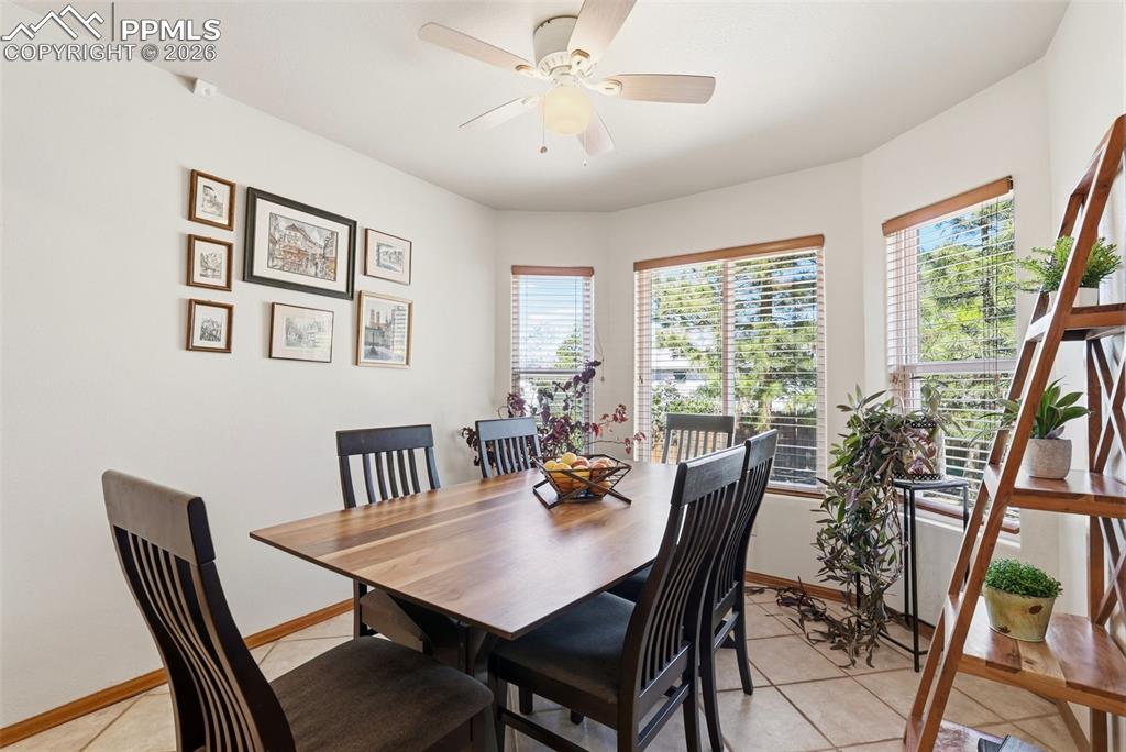 Image 18 of 50: Patio Access, Tile Floors, Ceiling Fan, Bay Window