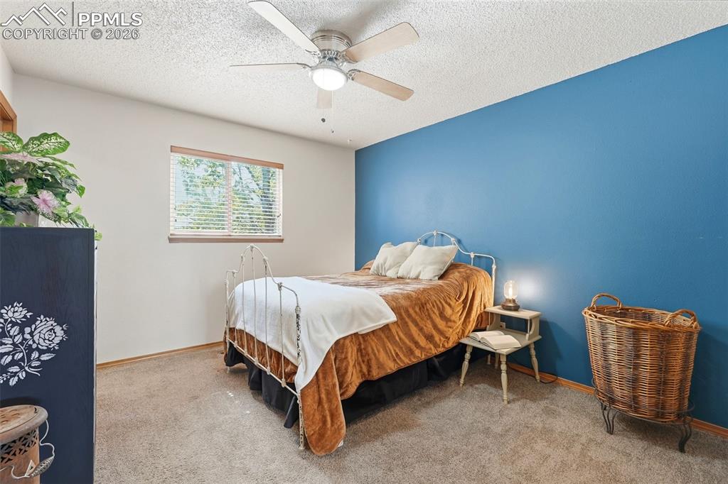 Image 27 of 50: Carpet, Ceiling Fan, Walk In Closet, Bathroom Access,  Wood Doors And Close