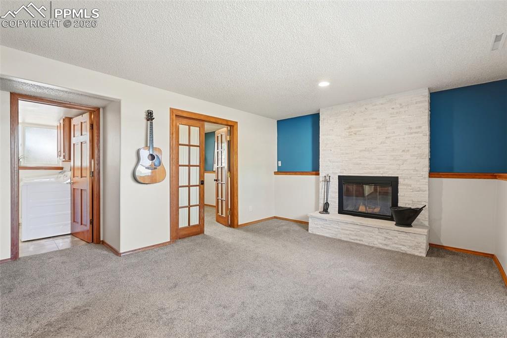 Image 33 of 50: Stone Fireplace, French Doors To Office