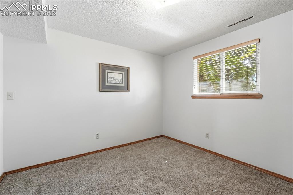 Image 36 of 50: Lower Level, Carpet, French Doors