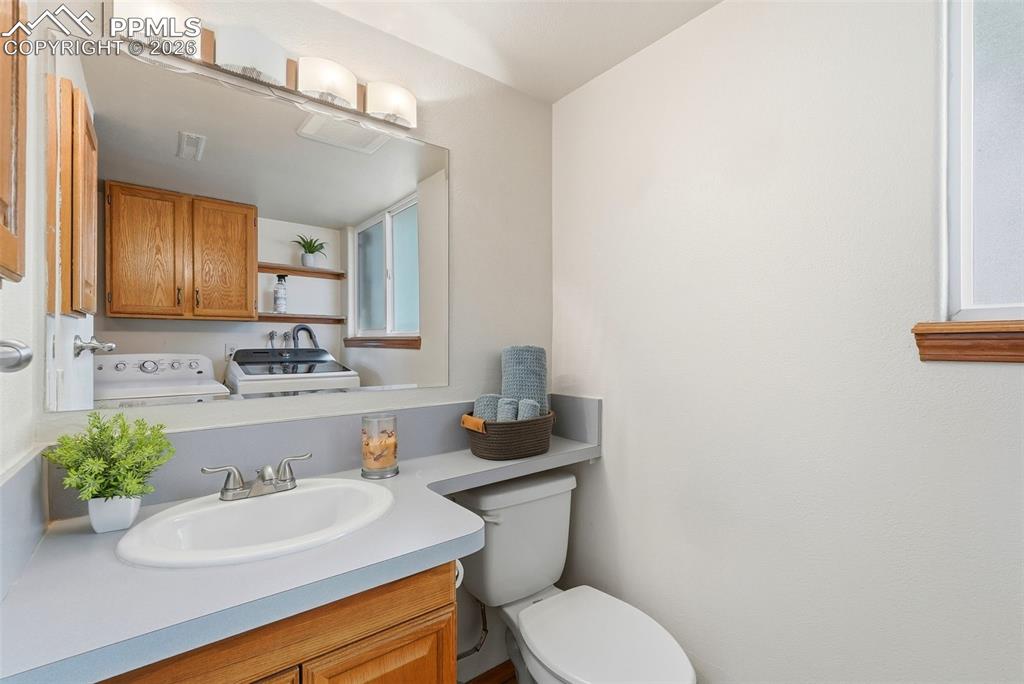 Image 38 of 50: Lower Level, Bathroom, Shower, Laundry, Tile, Window