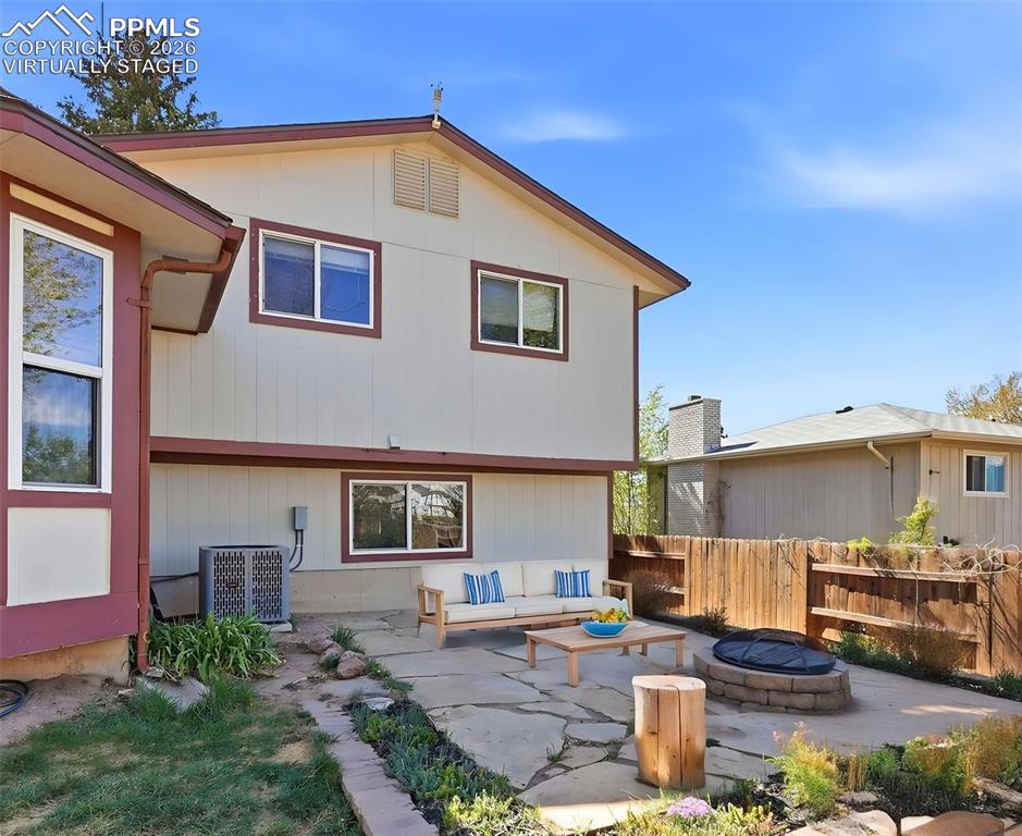 Image 41 of 50: Virtually Staged Stone Firepit And Seating Area