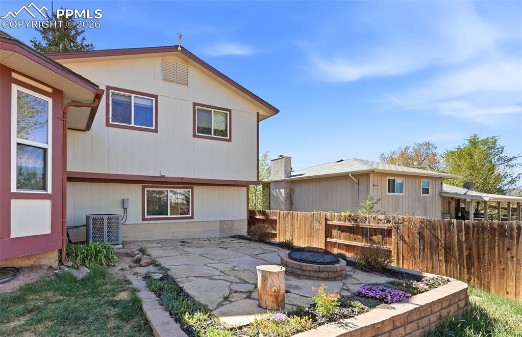 Image 42 of 50: Stone Firepit And Seating Area