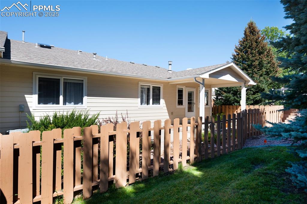 Image 31 of 38: View of property exterior with a shingled roof