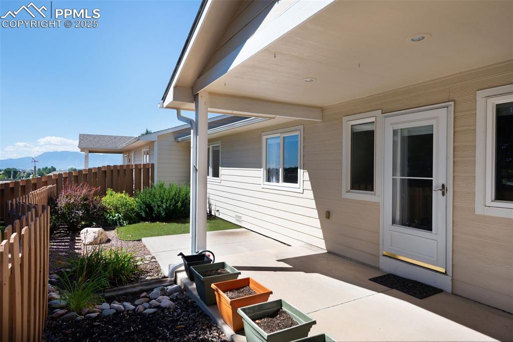 Image 32 of 38: View of patio with a mountain view