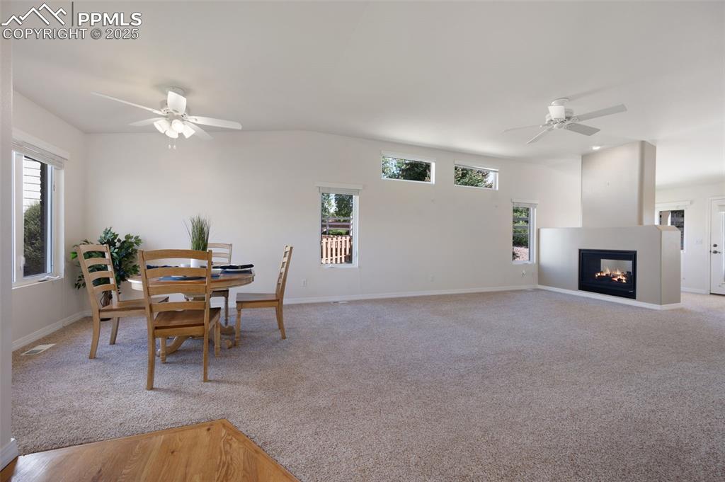 Image 5 of 38: Dining space with a ceiling fan, healthy amount of natural light, and light
