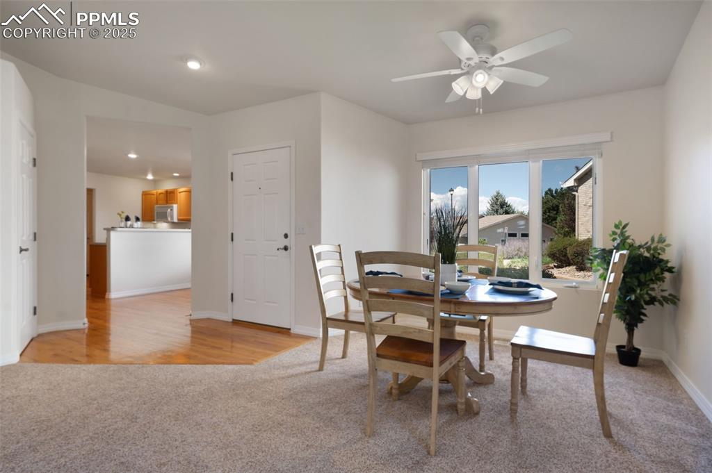 Image 9 of 38: Dining room featuring light carpet, recessed lighting, a ceiling fan, and l