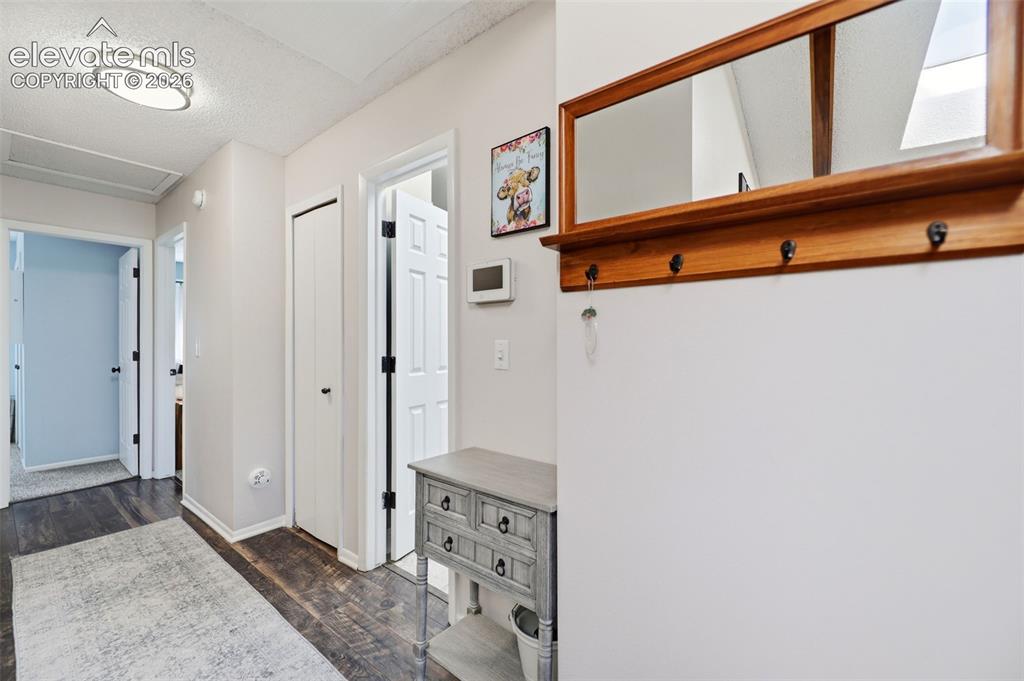 Image 15 of 37: Upper level hallway leading to 3 bedrooms, a bath and the laundry facilitie