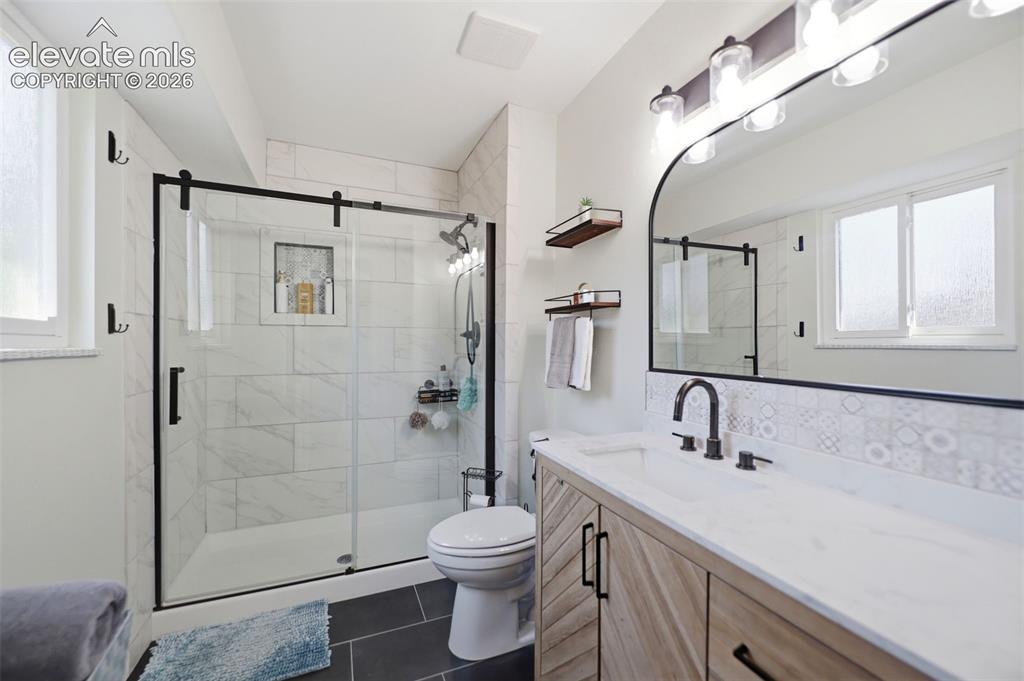 Image 18 of 37: Updated primary bathroom