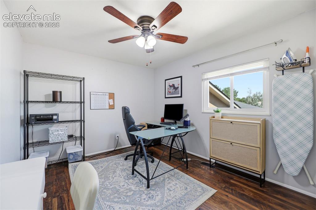 Image 19 of 37: Secondary bedroom being used as an office