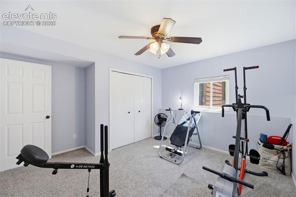 Image 20 of 37: Secondary bedroom currently being used as a gym