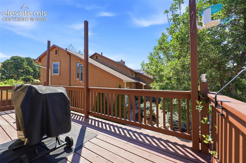 Image 33 of 37: Deck off of the kitchen/dining rooms with views of Pikes Peak