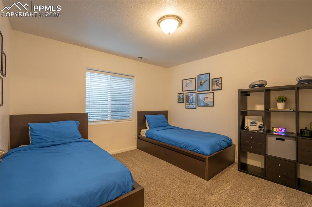 Image 29 of 39: Lower level, bedroom 1