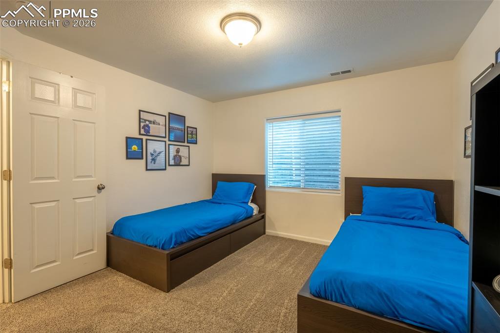 Image 30 of 39: Lower level, bedroom 1