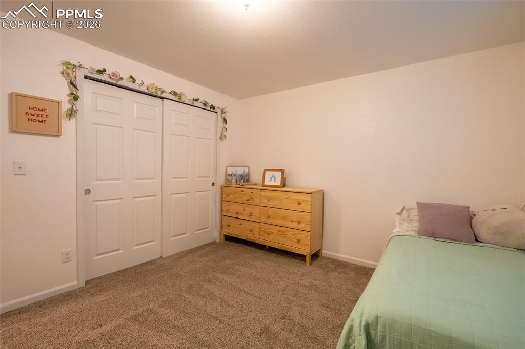 Image 32 of 39: Lower level, bedroom 2