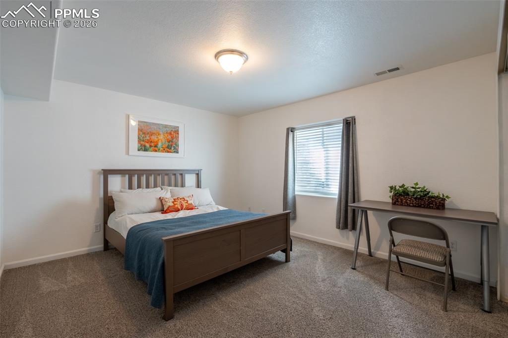 Image 33 of 39: Lower level, bedroom 3
