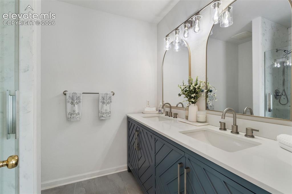 Image 24 of 50: Master Bath with double vanity