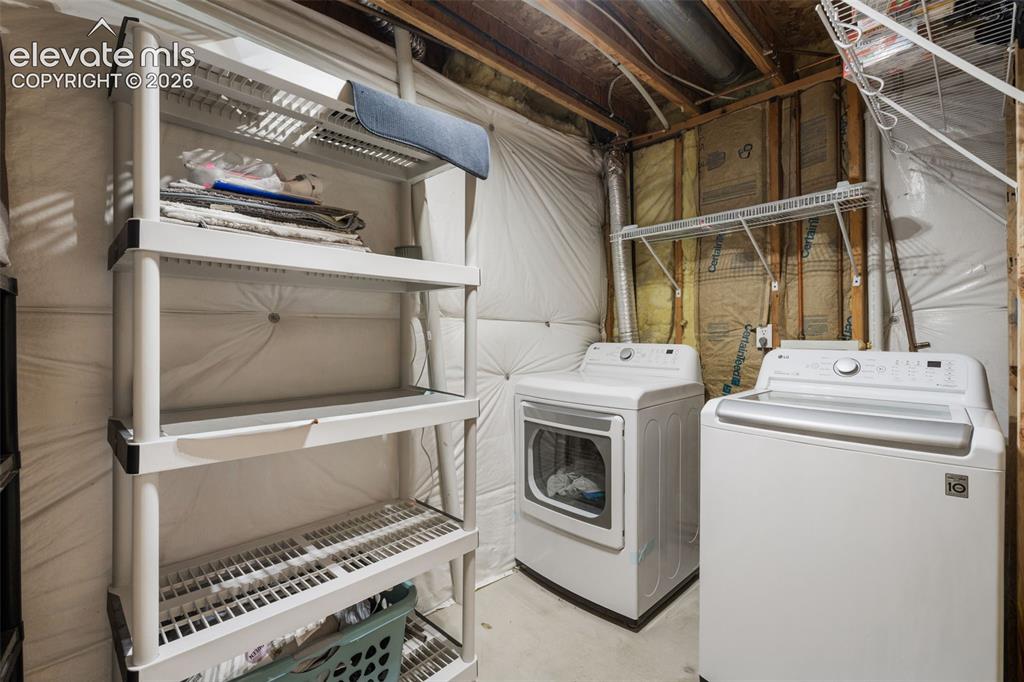 Image 37 of 50: Laundry and storage space in the basement