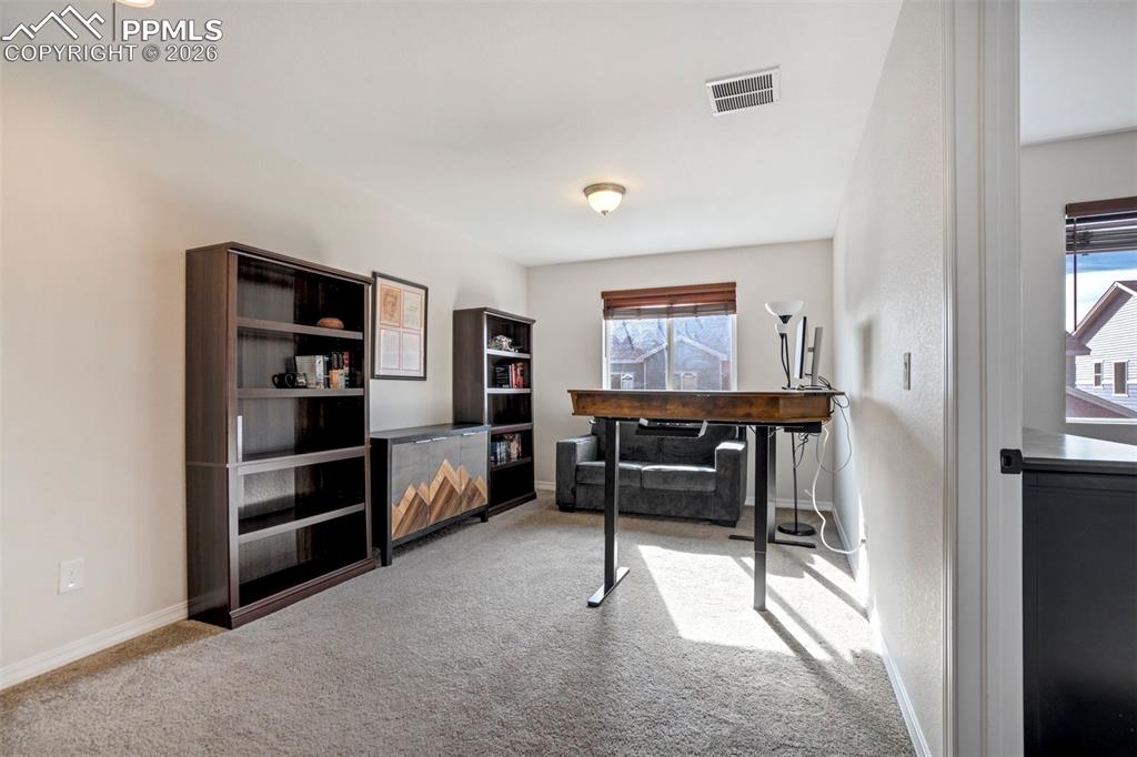 Image 20 of 48: Light filled flexible loft space, currently used as an office/studio, could