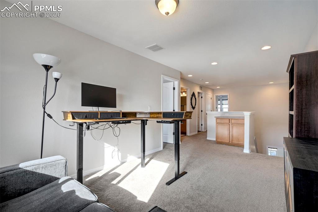 Image 22 of 48: Light filled flexible use loft area, currently used as office/studio.  